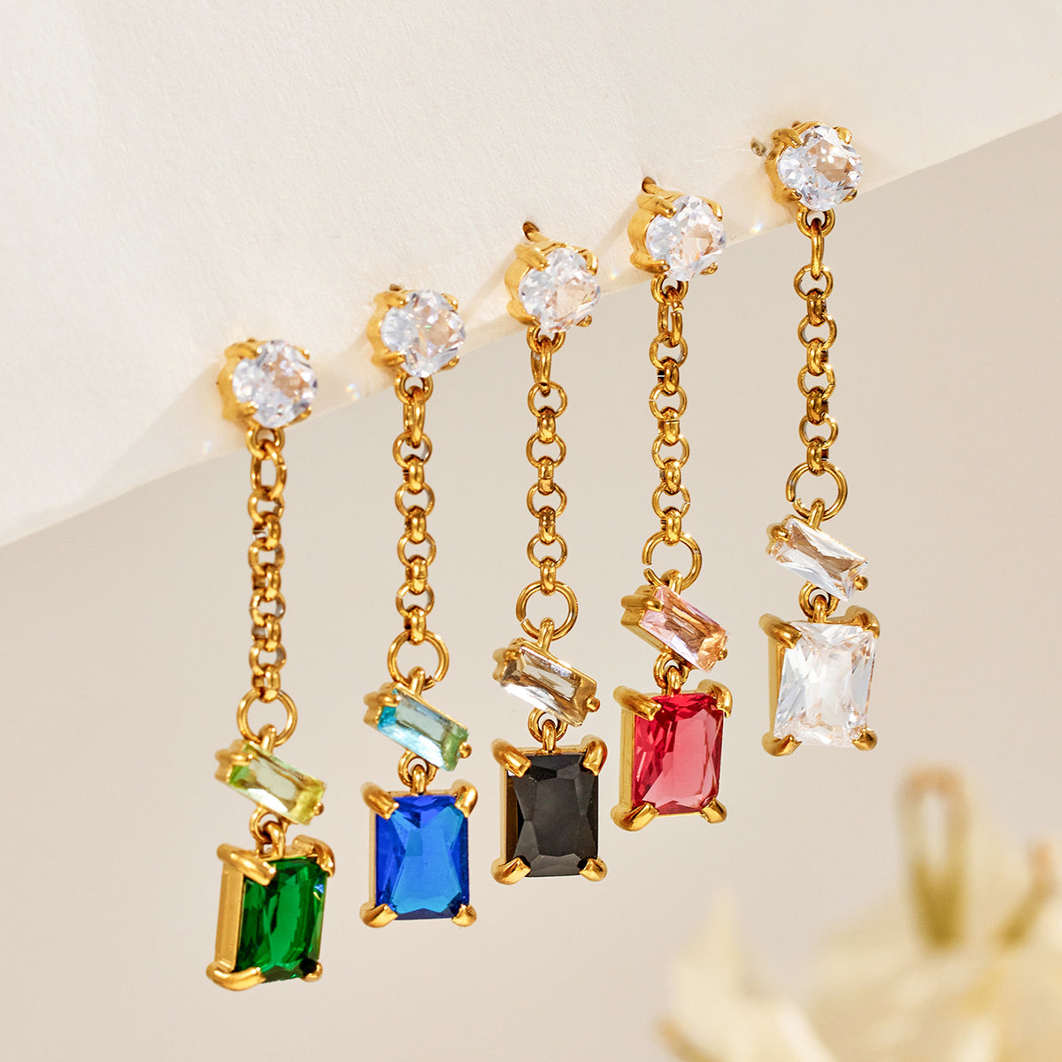 Colorful zircon drop earring assortment in green, blue, black, red and clear stones for wholesale boutique selection
