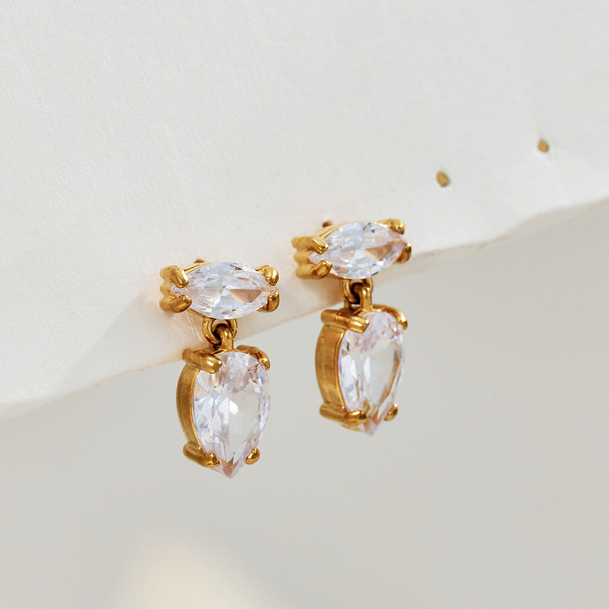 Clear zircon drop earrings with marquise and teardrop stones in an 18K gold PVD stainless steel setting