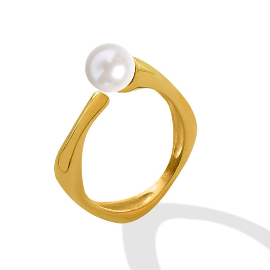 Gold-tone faux pearl open ring with an irregular sculptural band and single white pearl accent