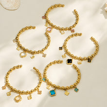 Five color options of gold four-leaf clover charm bracelets arranged together