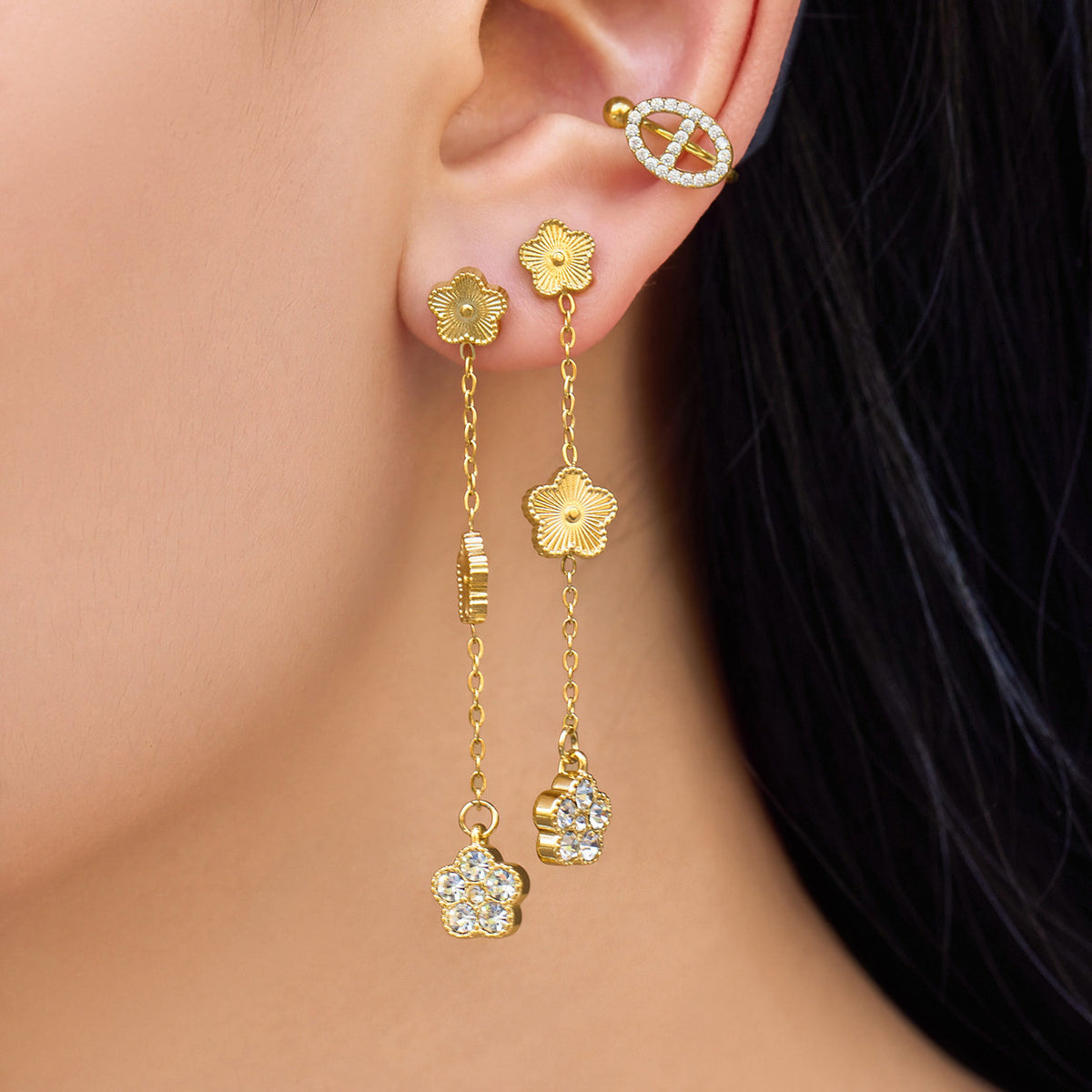 Gold flower zircon earrings on display