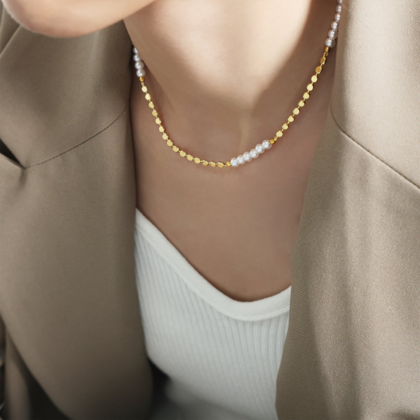 Model wearing freshwater pearl gold necklace with blazer for minimalist office jewelry and boutique gift displays-detail