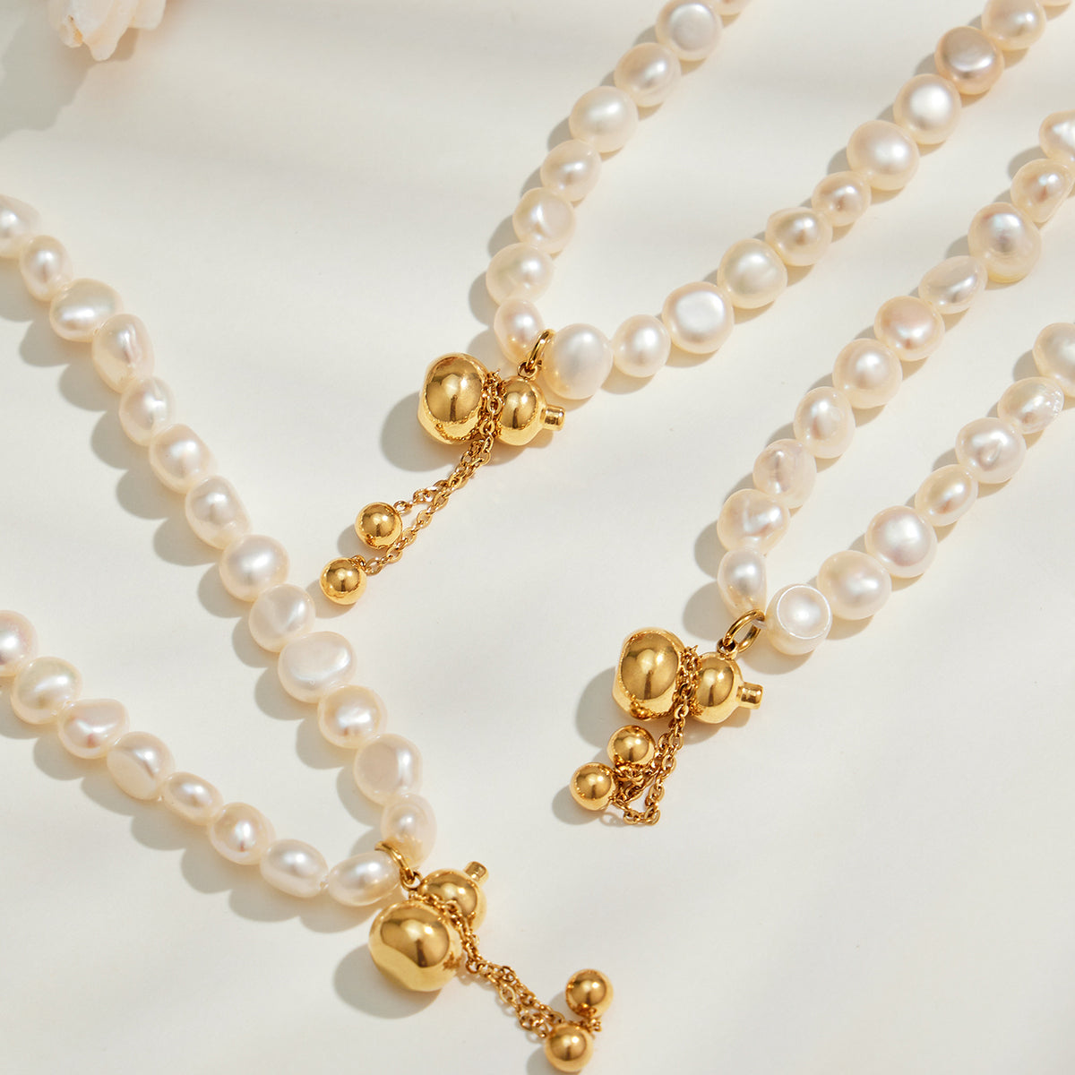 Freshwater pearl necklace gold clasp and charm details