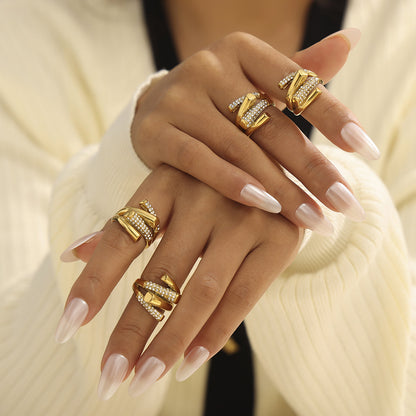 Geometric crisscross gold stainless steel ring worn on hand for fashion styling
