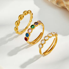 Three 18K PVD gold beaded ring styles featuring polished, multicolor CZ and white CZ designs