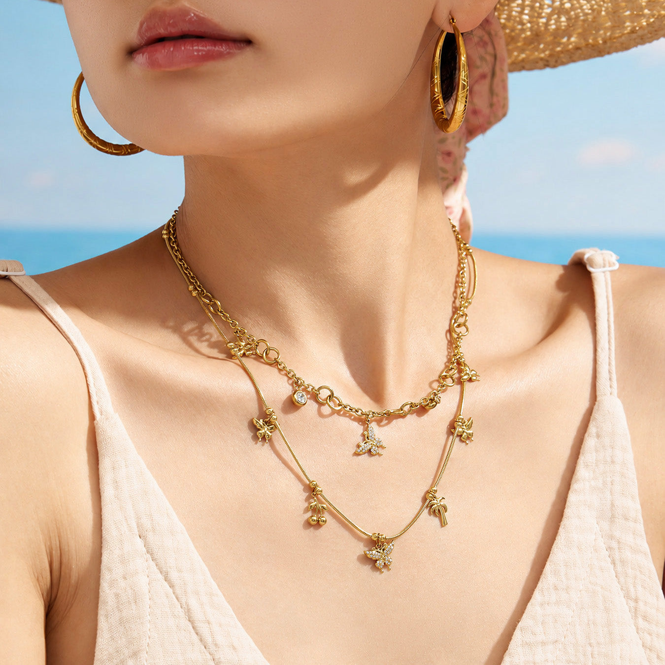 Close-up of a model wearing a gold butterfly zircon charm necklace
