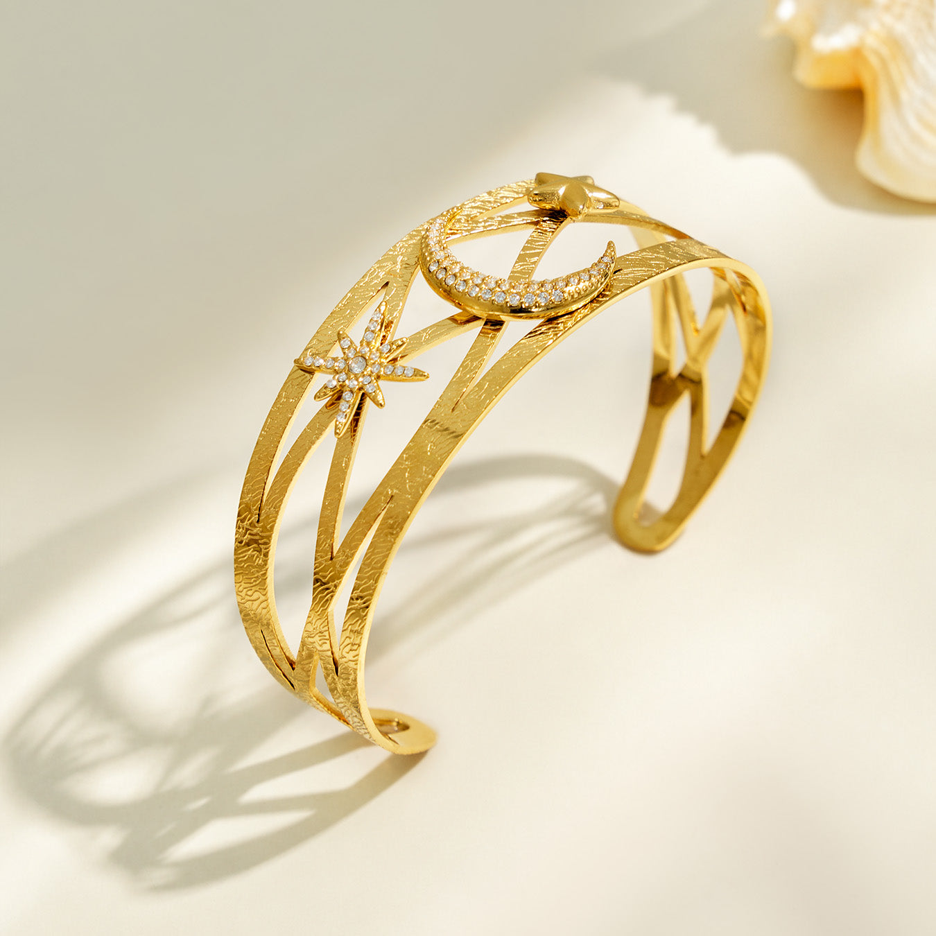 MiduoduoJewelry gold celestial cuff bracelet with layered bands, star and moon details
