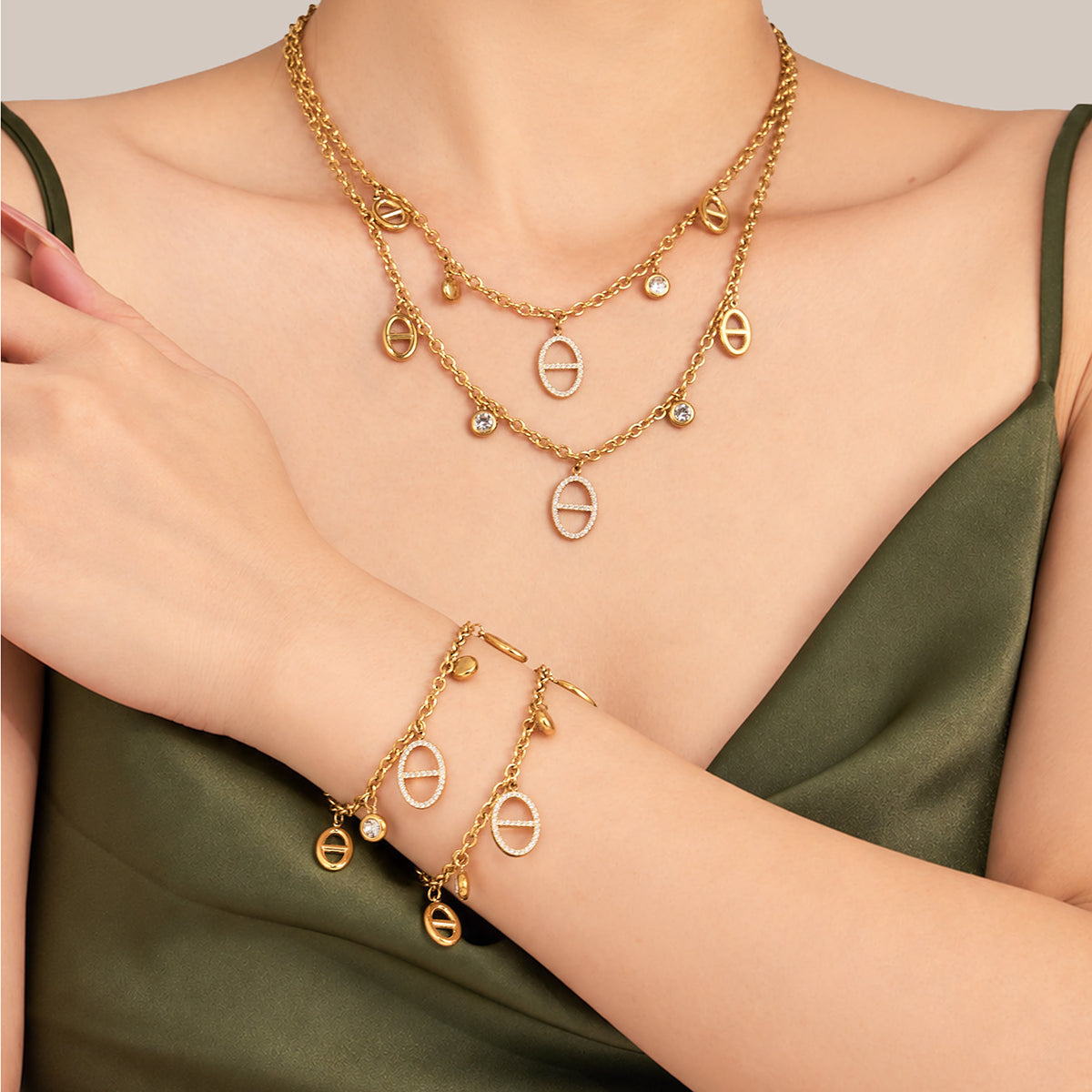 Gold zircon charm necklace and bracelet set styled together