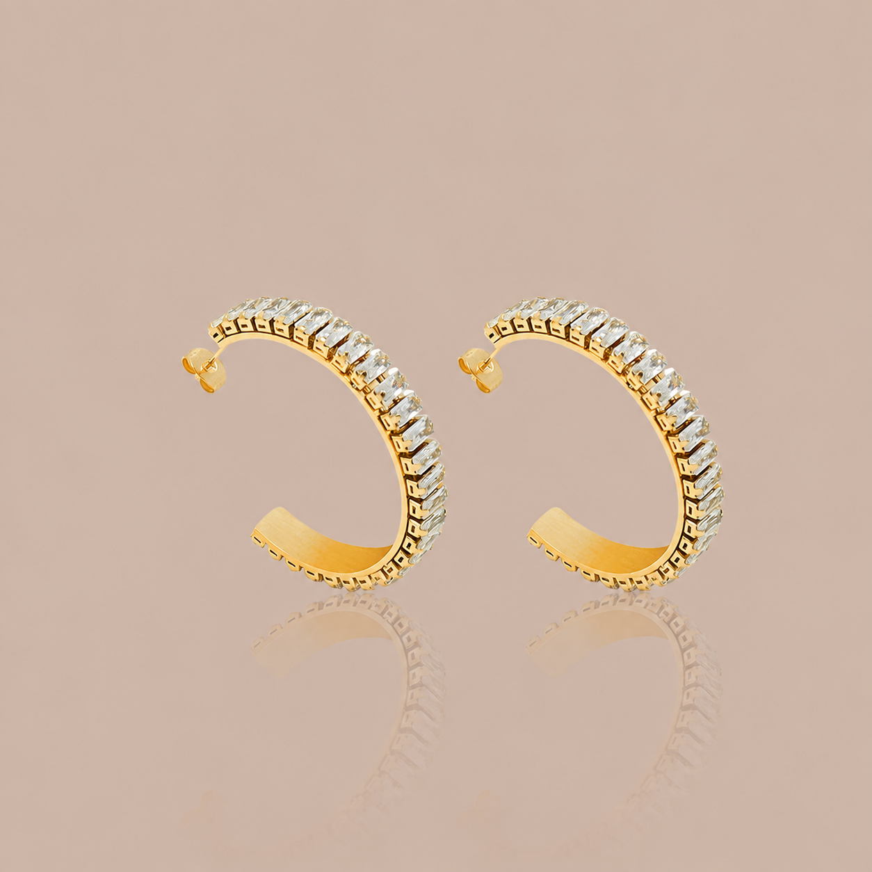 Gold C-shaped cubic zirconia hoop earrings with clear pavé-style stone setting