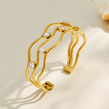 Gold three-layer open bangle with clear cubic zirconia accents