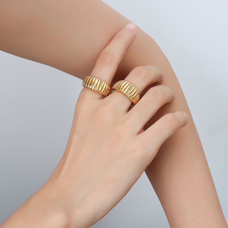 Gold chunky croissant ring worn on hand with wide ribbed band for trendy statement ring wholesale collections