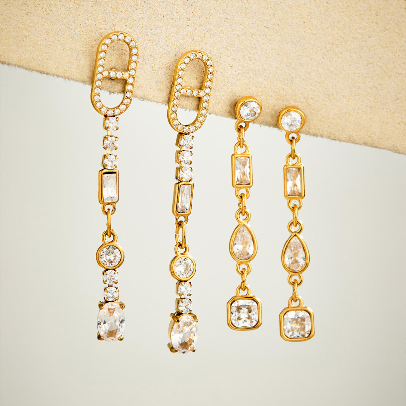 Gold cubic zirconia drop earrings in rectangular-link and linear dangle designs