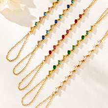 Five gold-tone hand chain bracelets arranged in rows showing stone colors and finger-chain loops