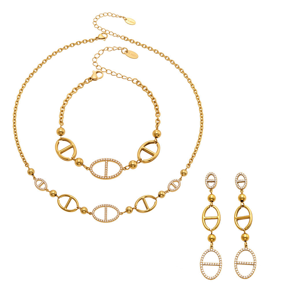 Gold D-shaped zircon necklace bracelet and drop earrings set in 316L stainless steel for boutique wholesale jewelry displays