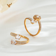 Pair of gold-tone stainless steel adjustable open rings with double cubic zirconia details