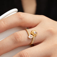 Gold-tone stainless steel double CZ adjustable open ring shown close up on finger