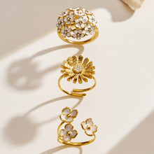 Collection of 18K PVD gold floral rings in daisy, enamel flower and CZ statement designs