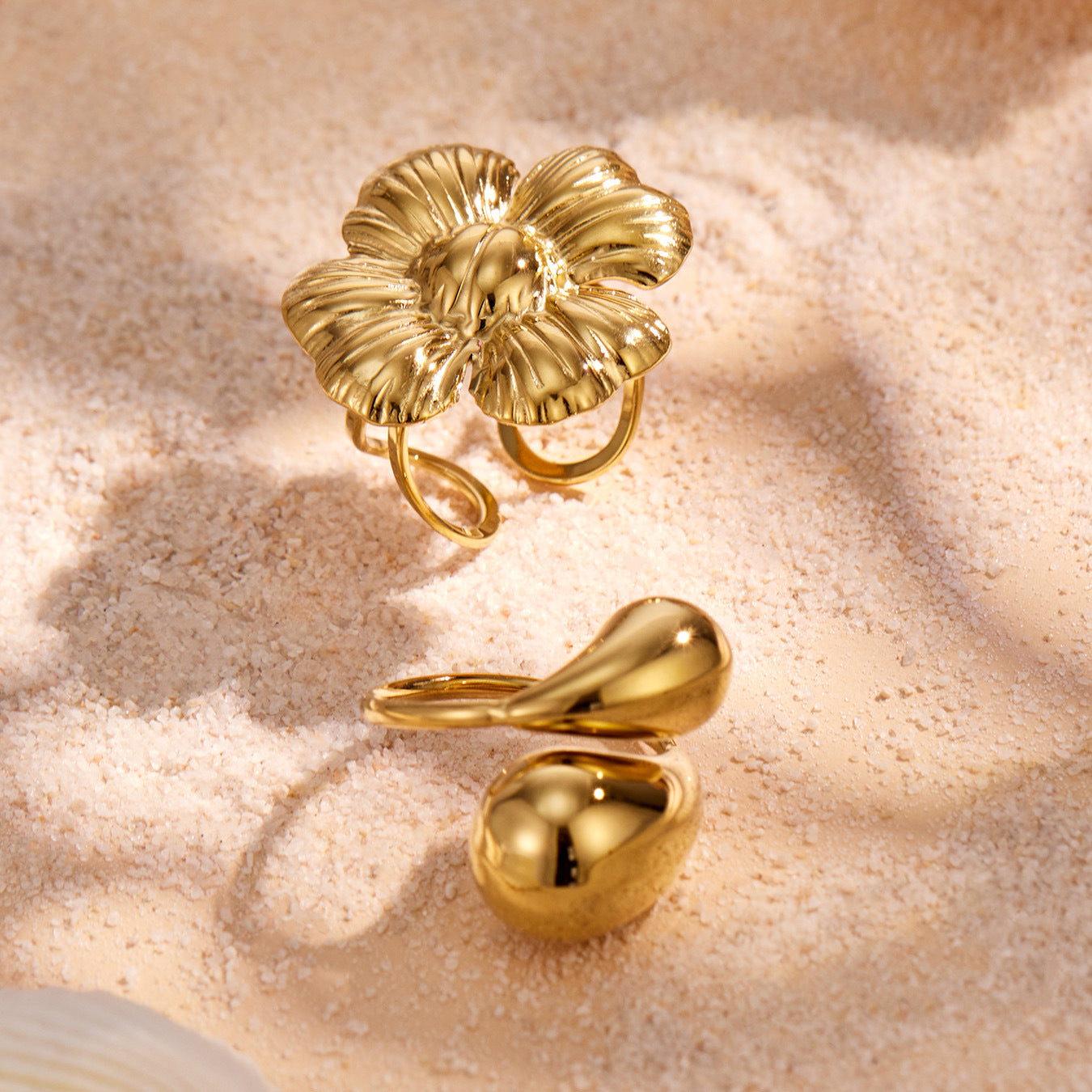 Gold flower open ring flat lay in 316L stainless steel with bold floral statement design