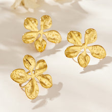 Three gold-tone stainless steel hammered flower rings displayed together
