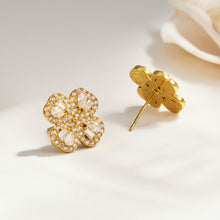 Gold-tone four-petal flower zircon stud earrings with pavé floral detail