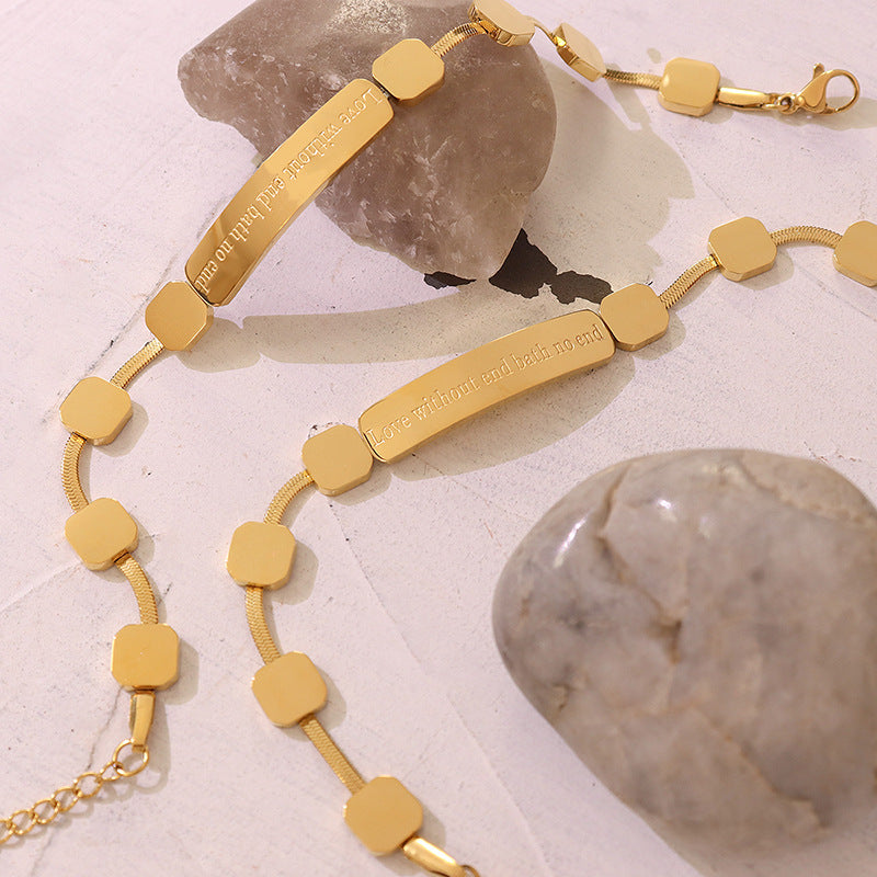 Gold geometric bar chain bracelet styled in a lifestyle jewelry setting