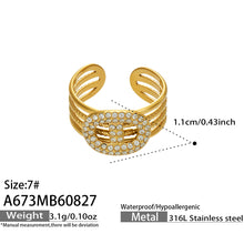Size and measurement details for a gold 316L stainless steel geometric CZ open ring