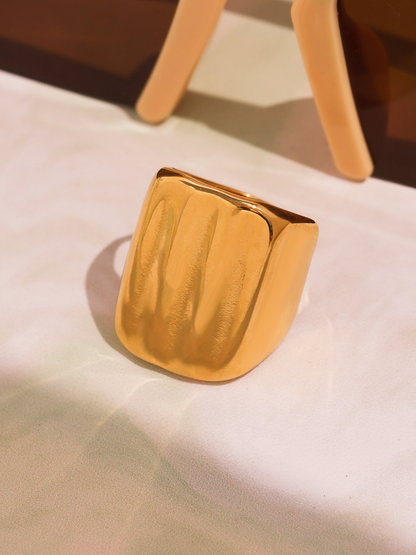 18K PVD gold geometric wide band ring product close-up with polished ridged surface