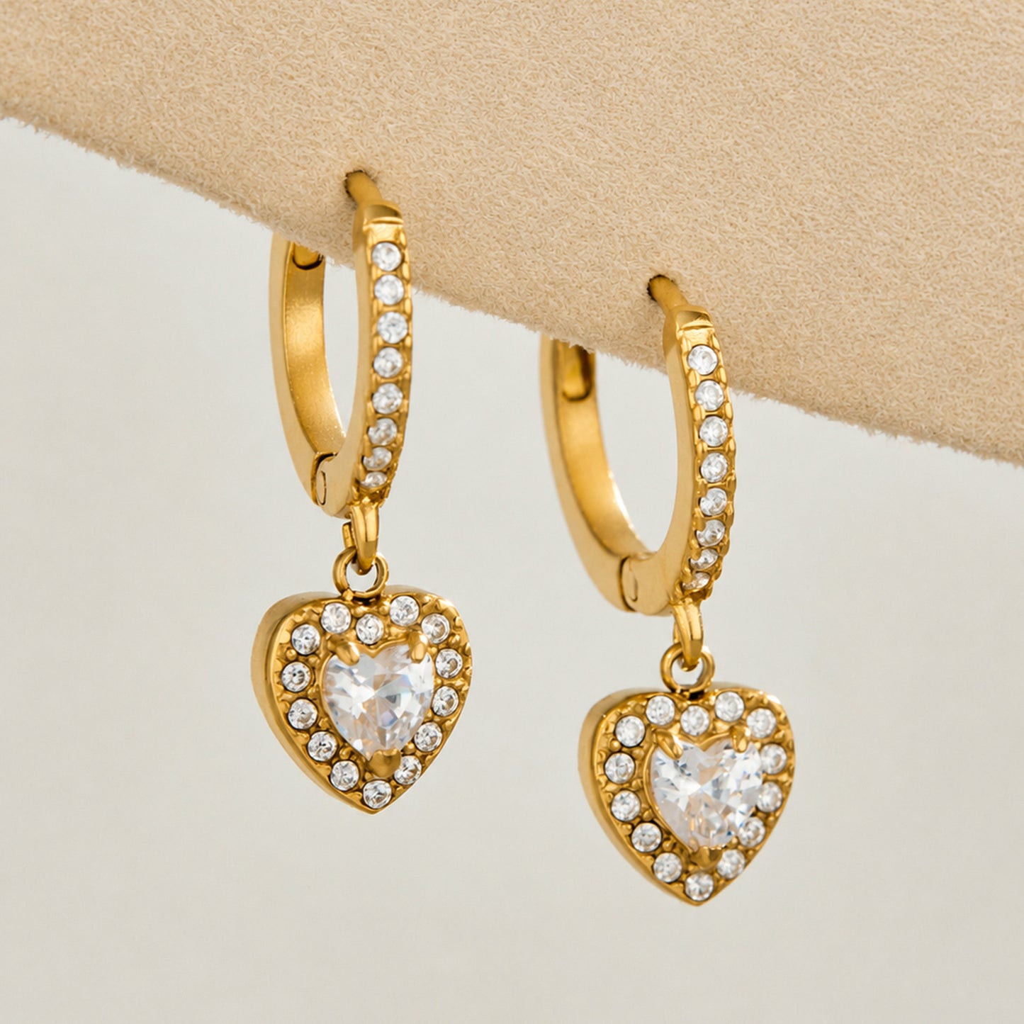 Gold heart cubic zirconia charm huggie earrings with clear sparkling stones