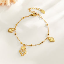 Gold heart zircon charm bracelet with adjustable chain and dangling heart pendants