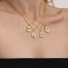 Layered gold iced out initial letter necklaces with zircon pendants for boutique personalized jewelry display