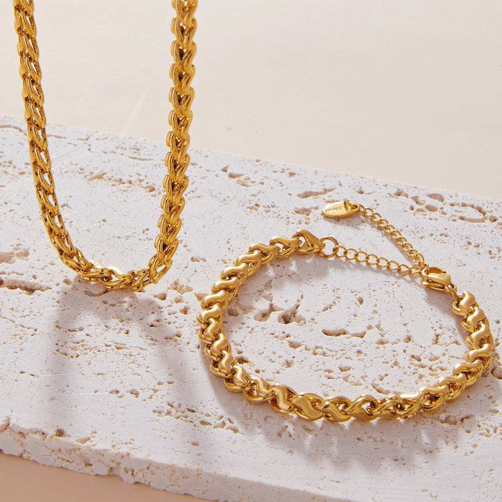 Model wearing a gold interlocking link copper bracelet