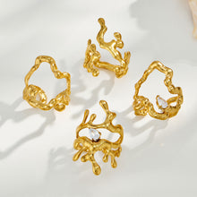 Collection of four gold 316L stainless steel irregular open rings in different sculptural styles