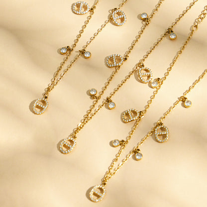 luxury gold layered necklace set with coin charms under soft shadow lighting