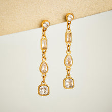 Gold linear cubic zirconia drop earrings with delicate long dangle design