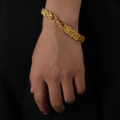Gold 18K PVD stainless steel textured bracelet with lobster clasp on wrist, hypoallergenic and water-resistant, minimalist men's jewelry