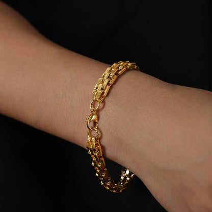 Gold 316L stainless steel textured lobster clasp bracelet on wrist, waterproof, hypoallergenic, streetwear jewelry for men and fashion boutiques