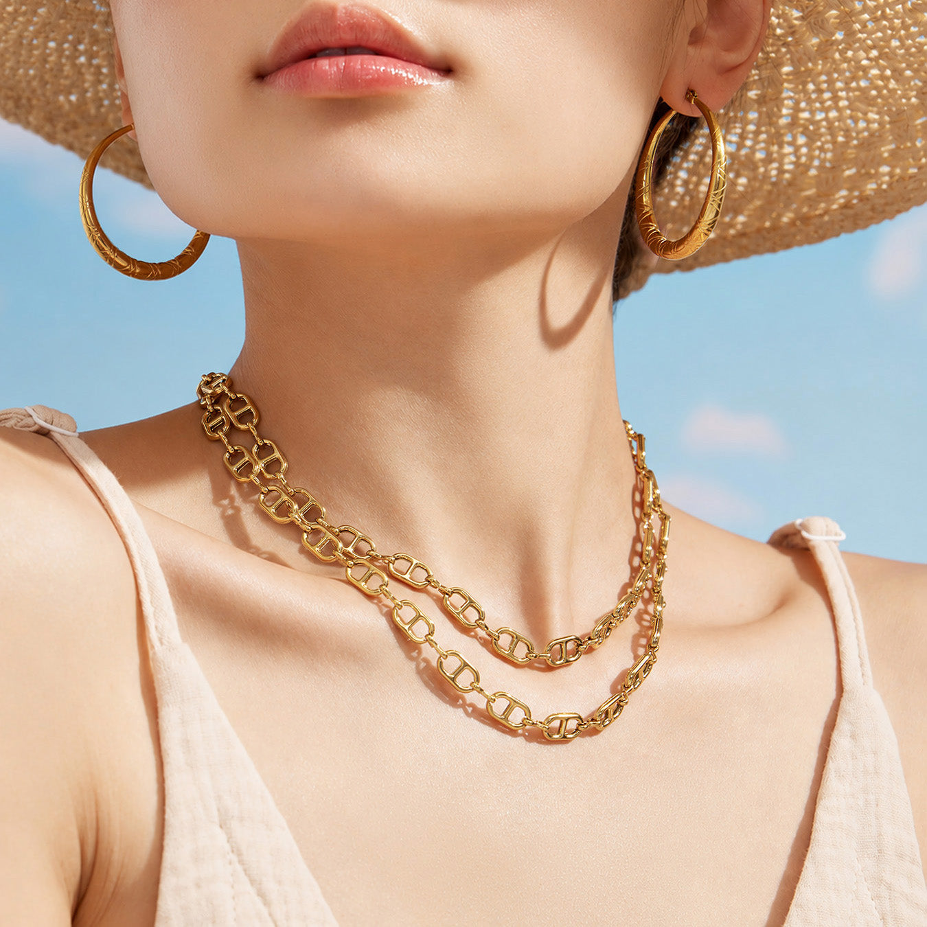 Gold mariner chain link necklace worn at the neckline with a summer outfit