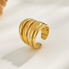 Gold tone 316L stainless steel multi-band open ring displayed on a light background