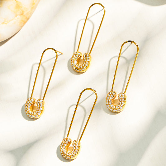 Gold paperclip-inspired drop earrings with clear cubic zirconia accents