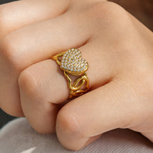 Gold pave heart cubic zirconia open ring in 316L stainless steel worn on a model finger