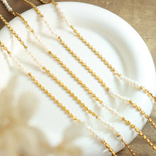Gold plated pearl splice necklace styled in soft sunlight with freshwater pearl details for summer jewelry collections