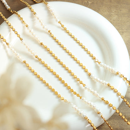 Gold plated pearl splice necklace styled in soft sunlight with freshwater pearl details for summer jewelry collections