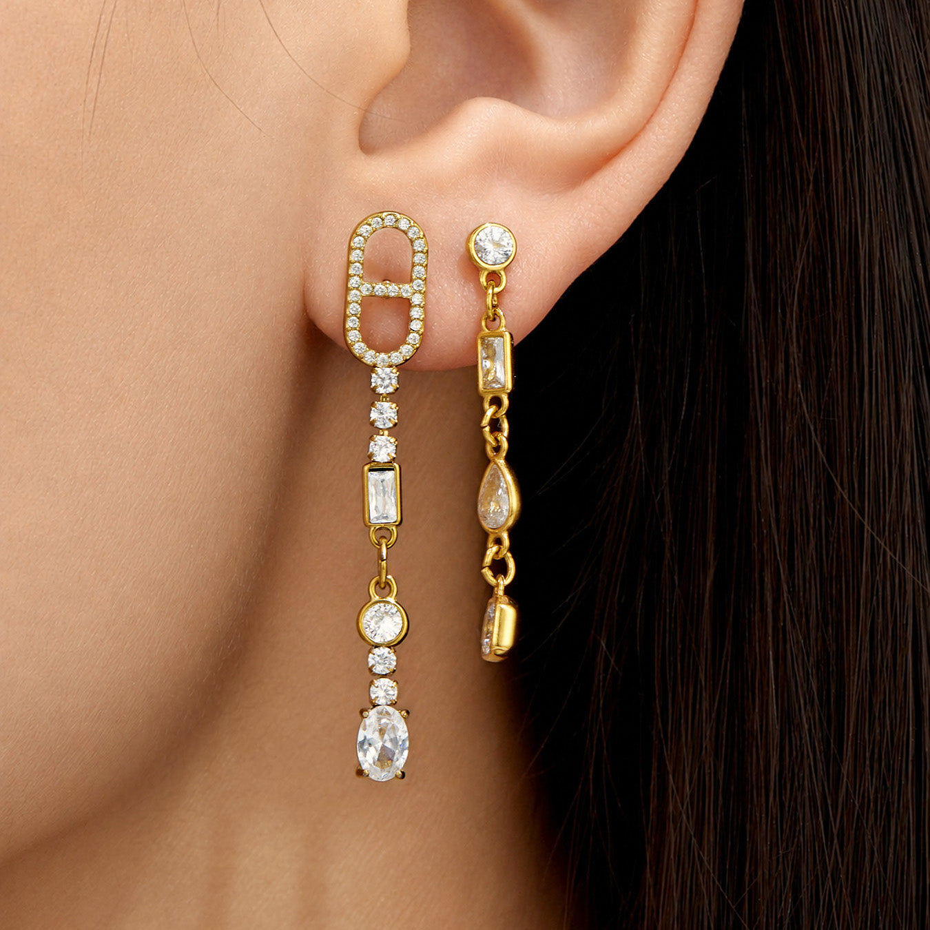 Model wearing gold rectangular-link cubic zirconia long drop earrings