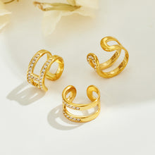 Gold-tone stainless steel rhinestone clip-on ear cuffs displayed as a product assortment