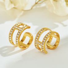 Gold-tone stainless steel rhinestone ear cuffs displayed for wholesale selection