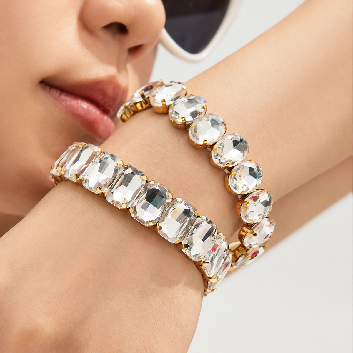 Gold rhinestone stretch bracelets with oversized faceted glass stones styled on wrist