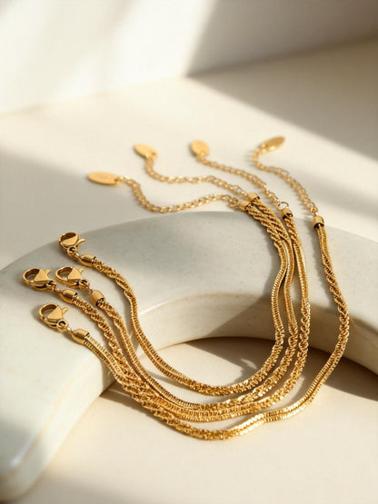 Gold rope chain bracelets flat lay with lobster clasp and extender chain for wholesale stainless steel jewelry buyers