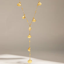 Gold scallop shell Y lariat necklace with zircon accents and long drop silhouette