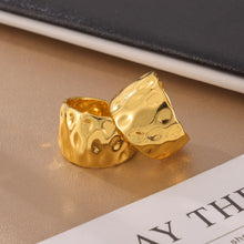 Gold sculptural open ring with organic hammered surface close-up