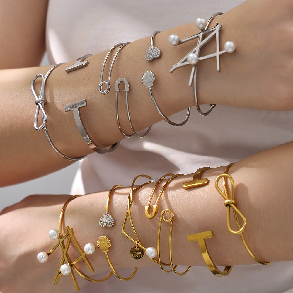 Hands stacked with gold & silver geometric line open bangle set, European-American high-end style